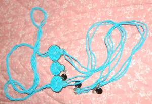 This piece of Maasai jewelry is called 'issurri'. It is a special ornament worn only by mothers whose sons are going through the Rite of Passage, also known as Warrior-hood (moranship)